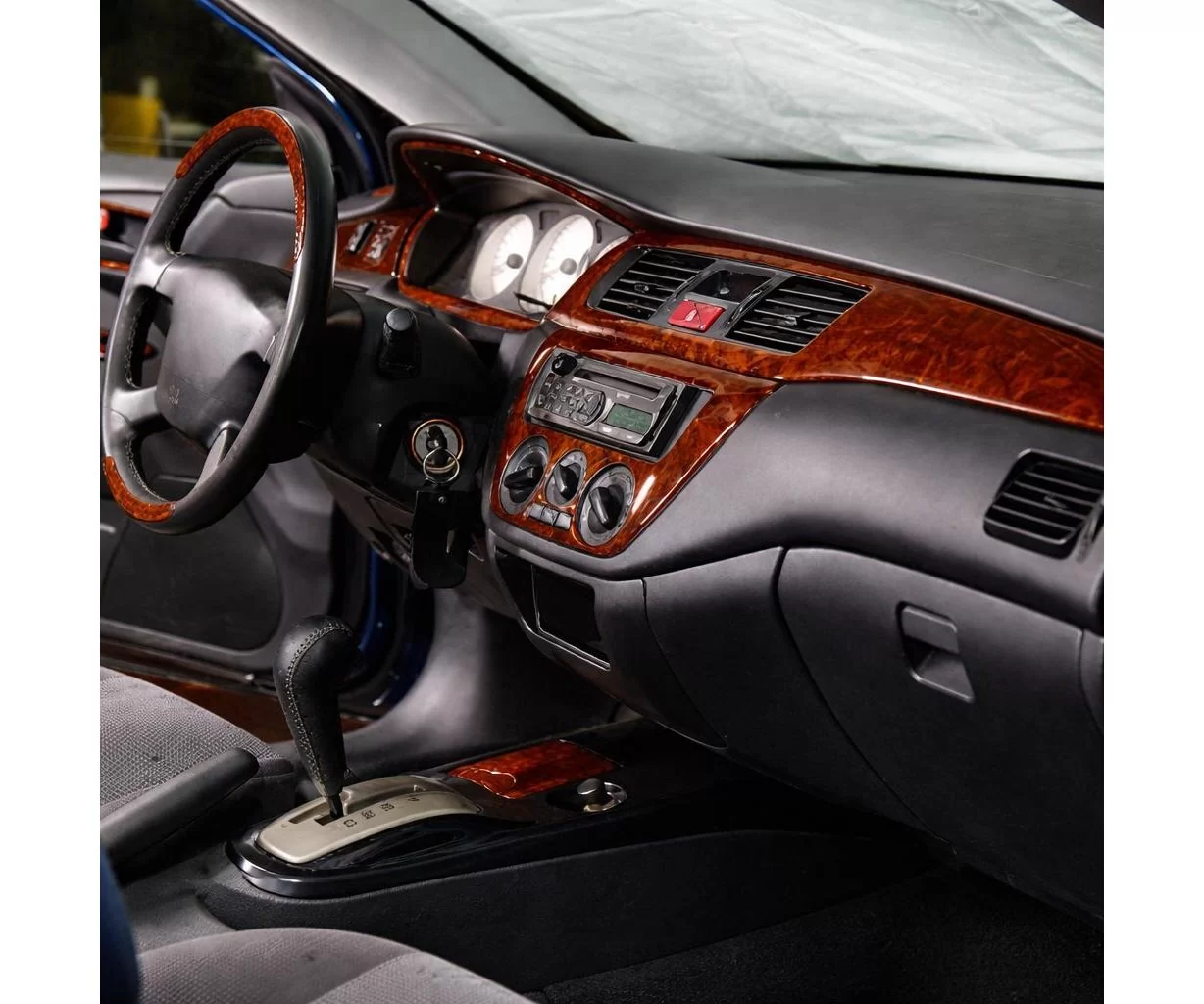 Mitsubishi Colt-Lancer 01.2002 Mascherine sagomate per rivestimento cruscotti 23-Decori